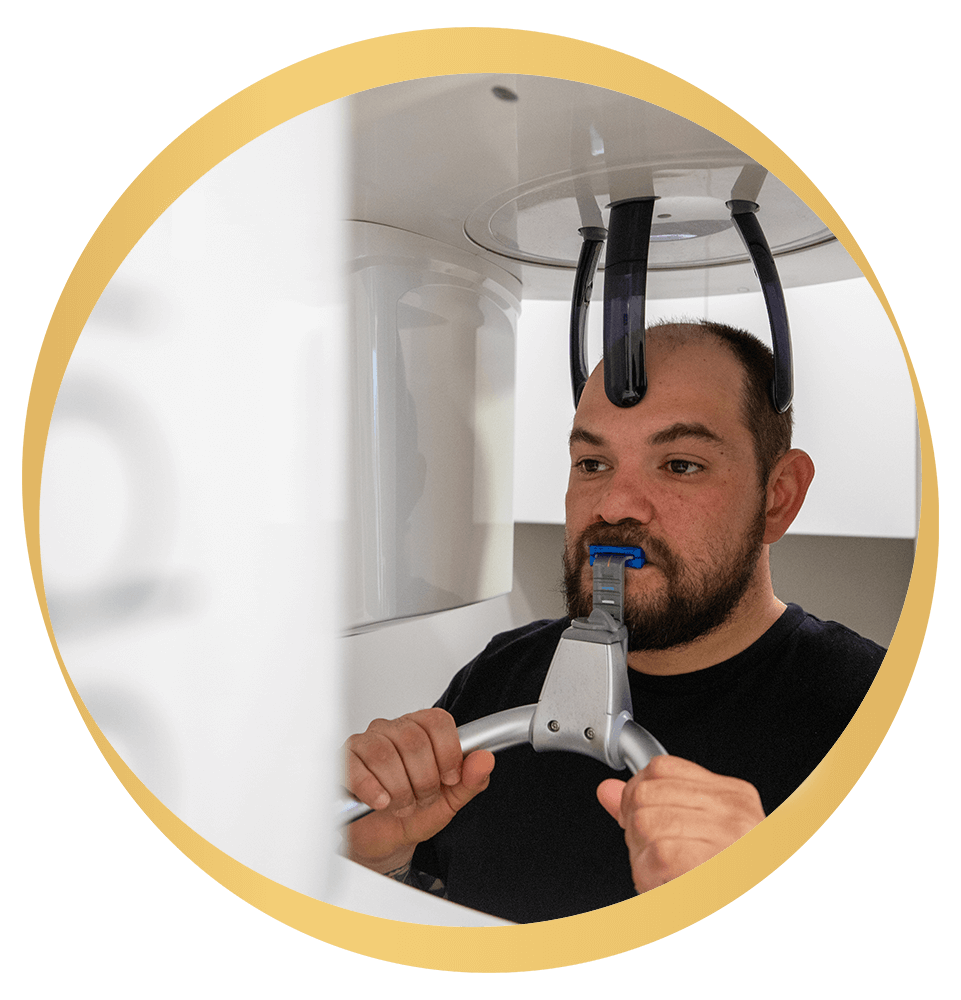 Patient in the middle of taking a dental x-ray