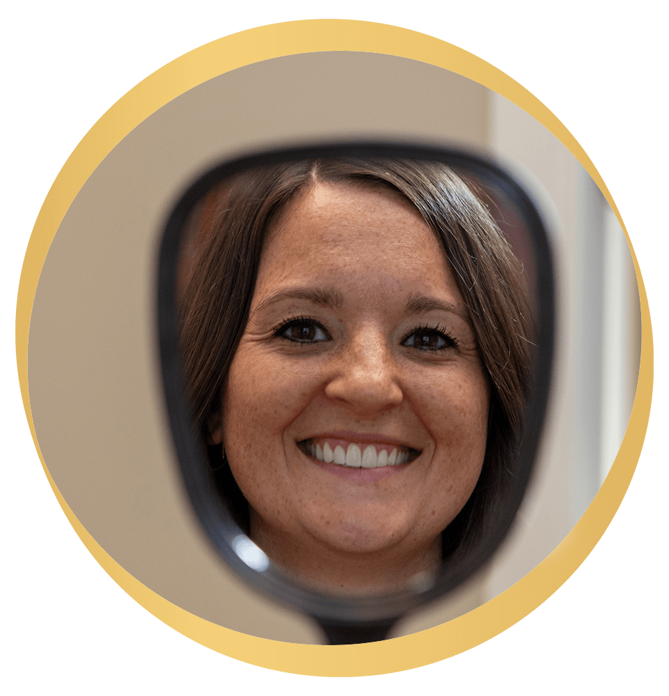 Woman looking into mirror